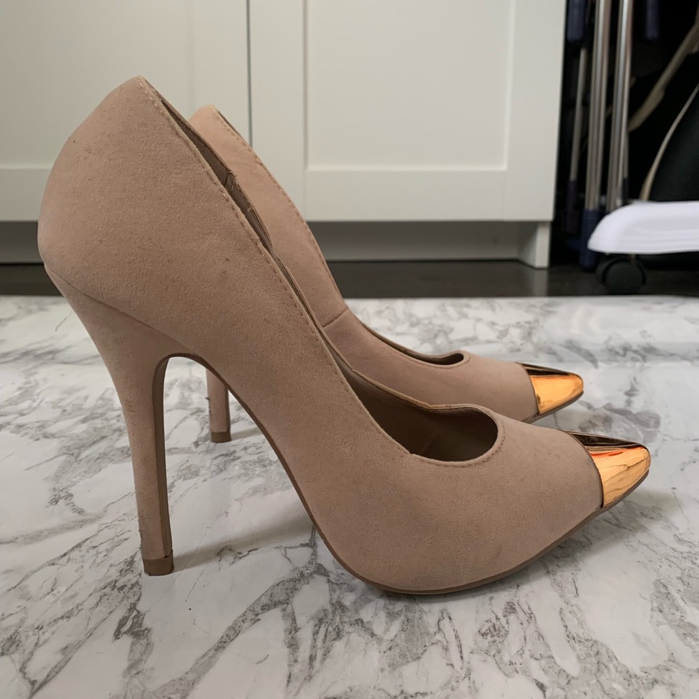 Shoedazzle nude pumps with gold capped toes.